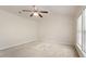 Minimal bedroom featuring neutral carpeting, vaulted ceiling and large window for natural light at 402 Halls Mill Dr, Cary, NC 27519