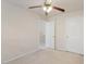 Bedroom with neutral paint, carpet floor, and two access doors at 402 Halls Mill Dr, Cary, NC 27519