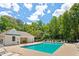 Community pool with lounge chairs and a covered area, perfect for summer relaxation and recreation at 402 Halls Mill Dr, Cary, NC 27519