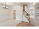 Formal dining room with wainscoting, chandelier, and a built-in cabinet at 402 Halls Mill Dr, Cary, NC 27519