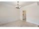 Open dining room space showcasing a chandelier and decorative wall trim at 402 Halls Mill Dr, Cary, NC 27519