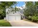 Well-maintained two-story home with a two-car garage and a beautiful front yard at 402 Halls Mill Dr, Cary, NC 27519