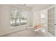 Inviting living room with french doors, a large window and hardwood flooring at 402 Halls Mill Dr, Cary, NC 27519
