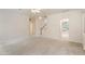 Spacious living room area featuring staircase and seamless access to other areas at 402 Halls Mill Dr, Cary, NC 27519