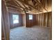 Exposed wood framing in a room ready to be customized, filled with natural light from exterior windows at 433 Old Fashioned Way, Lillington, NC 27546