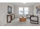Bright bonus room featuring stylish seating and artwork, creating an inviting and relaxing atmosphere at 433 Old Fashioned Way, Lillington, NC 27546