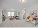 Bright bonus room with neutral carpet, a desk, and a view of the entryway to a bright bathroom at 433 Old Fashioned Way, Lillington, NC 27546