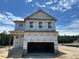 New two-story home with visible framework and covered front porch, ready to customize at 433 Old Fashioned Way, Lillington, NC 27546