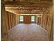Spacious room under construction featuring exposed wood framing and natural light from windows at 433 Old Fashioned Way, Lillington, NC 27546