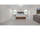 Spacious main bedroom with lots of carpet, two windows, and a sleek dresser at 433 Old Fashioned Way, Lillington, NC 27546