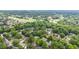A lush green neighborhood of mature trees and manicured lawns surrounds a beautiful golf course at 441 Fieldstone Dr, Burlington, NC 27215