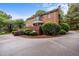 This brick home has a circular driveway and manicured shrubs in the front yard at 441 Fieldstone Dr, Burlington, NC 27215