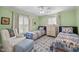 Charming bedroom features two twin beds, neutral walls, and windows with plantation shutters at 441 Fieldstone Dr, Burlington, NC 27215