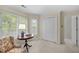 Bright bedroom with sitting area, large windows, and a closet at 441 Fieldstone Dr, Burlington, NC 27215