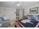 Bedroom with neutral walls, carpet, queen bed, chair, and bookshelf at 441 Fieldstone Dr, Burlington, NC 27215