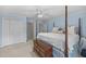Comfortable bedroom with a four poster bed and ample natural light at 441 Fieldstone Dr, Burlington, NC 27215
