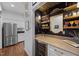 Convenient butler's pantry with wine storage, a serving counter, and seamless access to the kitchen area at 441 Fieldstone Dr, Burlington, NC 27215