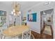 Bright dining room with a view into the kitchen and entry hallway at 441 Fieldstone Dr, Burlington, NC 27215