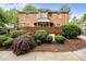 Well-maintained brick home with lush landscaping, offering privacy and curb appeal at 441 Fieldstone Dr, Burlington, NC 27215