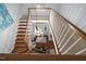 Grand two-story foyer features a wooden staircase, bright lighting, and hardwood floors at 441 Fieldstone Dr, Burlington, NC 27215