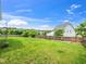 Expansive, well-maintained backyard with lush green grass and secure wooden fencing at 4502 Joe Cotton Dr, Knightdale, NC 27545