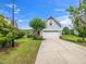 Light blue home featuring an attached two-car garage and a long driveway at 4502 Joe Cotton Dr, Knightdale, NC 27545