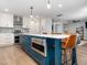 Renovated kitchen featuring a large island with a built-in microwave and seating space, complemented by modern appliances at 4502 Joe Cotton Dr, Knightdale, NC 27545