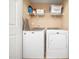 Functional laundry area with modern washer and dryer and convenient storage shelves at 4502 Joe Cotton Dr, Knightdale, NC 27545