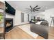 Cozy living room featuring a fireplace, hardwood floors, and contemporary furnishings at 4502 Joe Cotton Dr, Knightdale, NC 27545