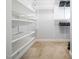 Well-organized walk-in closet with adjustable shelving and hanging rods, maximizing storage space for clothing and accessories at 4502 Joe Cotton Dr, Knightdale, NC 27545