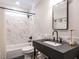 Modern bathroom features marble tiled shower and black fixtures at 4716 Shadow Ridge Ct, Holly Springs, NC 27540