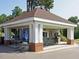 Outdoor snack bar area featuring seating, a service window, and a covered structure for shade at 4716 Shadow Ridge Ct, Holly Springs, NC 27540