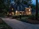 Beautiful two-story brick home with a well-manicured lawn and a spacious driveway, showcasing classic elegance and curb appeal at 4716 Shadow Ridge Ct, Holly Springs, NC 27540