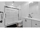 Clean bathroom features a glass-enclosed shower and modern vanity with stylish fixtures at 5110 Old Well St, Durham, NC 27704