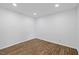 Bright bedroom with wood-look floors and neutral walls, a clean and inviting space for relaxation at 5110 Old Well St, Durham, NC 27704