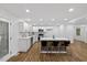 Modern kitchen with a large island, sleek countertops, and stainless steel appliances, perfect for cooking and entertaining at 5110 Old Well St, Durham, NC 27704