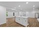 Spacious living room with wood floors and a center island is perfect for entertaining at 5110 Old Well St, Durham, NC 27704