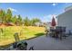 Spacious backyard features a patio with seating and a lush grassy area at 512 Barneswyck Dr, Fuquay Varina, NC 27526