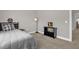 Neutral bedroom with toys and decor, featuring a comfortable bed and stylish decor items at 512 Barneswyck Dr, Fuquay Varina, NC 27526