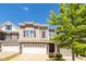 Inviting townhome with a well-manicured front lawn and a convenient two-car garage on a bright day at 512 Barneswyck Dr, Fuquay Varina, NC 27526