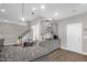 Bright kitchen featuring granite countertops, stainless appliances, and a stylish range hood at 512 Barneswyck Dr, Fuquay Varina, NC 27526