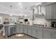 Modern kitchen with granite countertops and stainless appliances open to the living area at 512 Barneswyck Dr, Fuquay Varina, NC 27526