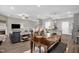Open concept living area with modern furnishings, fireplace and a view into the kitchen at 512 Barneswyck Dr, Fuquay Varina, NC 27526