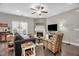 Comfortable living space with a fireplace and soft, neutral colors, perfect for relaxing and entertaining at 512 Barneswyck Dr, Fuquay Varina, NC 27526