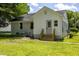 Backyard view of house exterior with back door at 605 E Montgomery St, Henderson, NC 27536