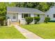 Attractive single-story home with a neat front yard and a walkway leading to the entrance at 605 E Montgomery St, Henderson, NC 27536