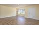 Inviting living room showcases updated flooring, light walls, and ample natural light at 605 E Montgomery St, Henderson, NC 27536