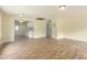 Spacious, light-filled living area featuring new vinyl floors and fresh paint at 605 E Montgomery St, Henderson, NC 27536