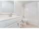 White bathroom with vanity, shower, and toilet at 606 Arden St, Burlington, NC 27215