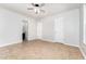 Neutral bedroom with tile floors, ceiling fan, and ensuite bathroom access for flexible living at 606 Arden St, Burlington, NC 27215